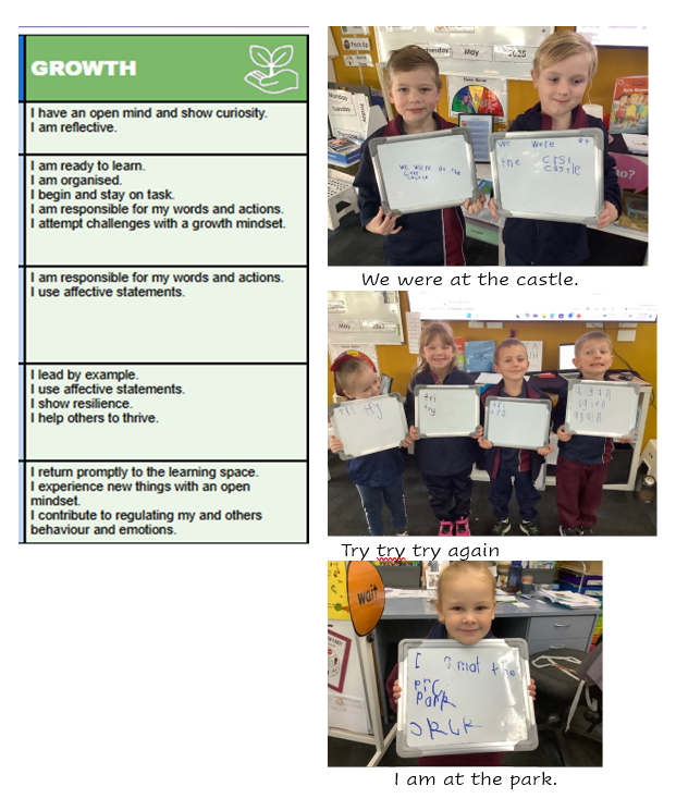 A group of children holding whiteboardsDescription automatically generated